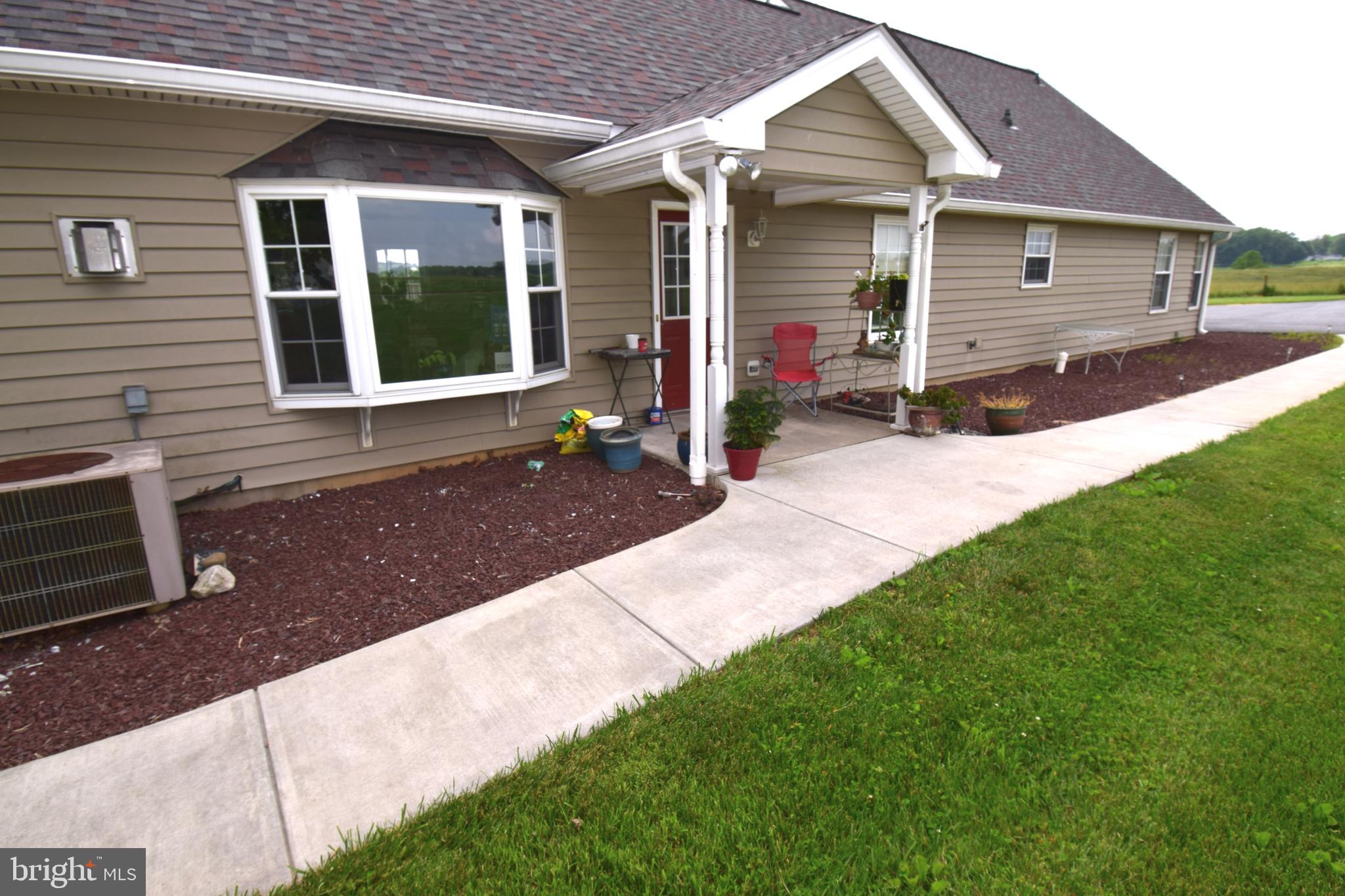 3875 Bark Hill Road Union Bridge, MD 21791 - Photo 112 of 142 a front view of a house with a yard and porch