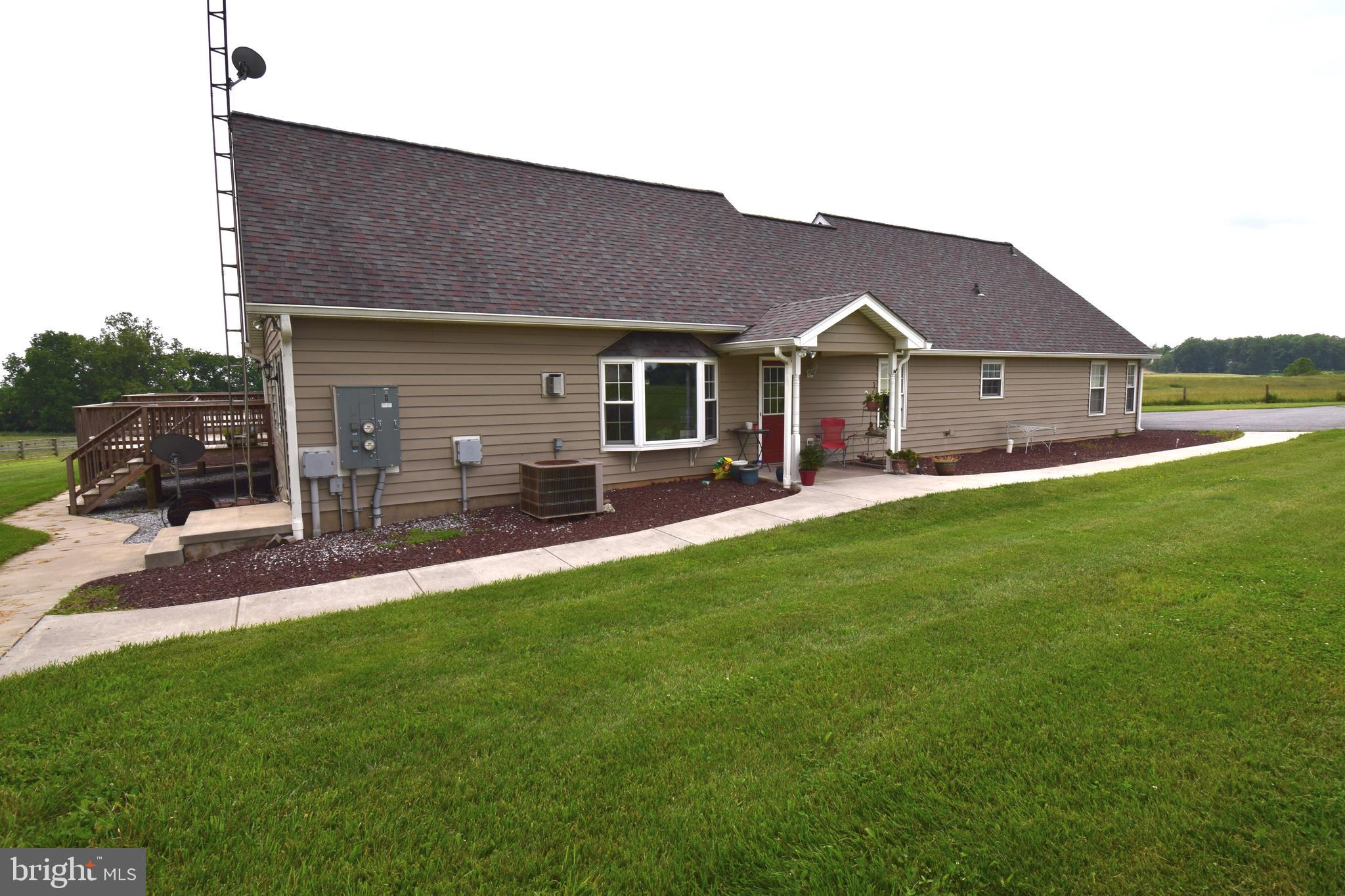 3875 Bark Hill Road Union Bridge, MD 21791 - Photo 113 of 142 a front view of a house with a yard and garage