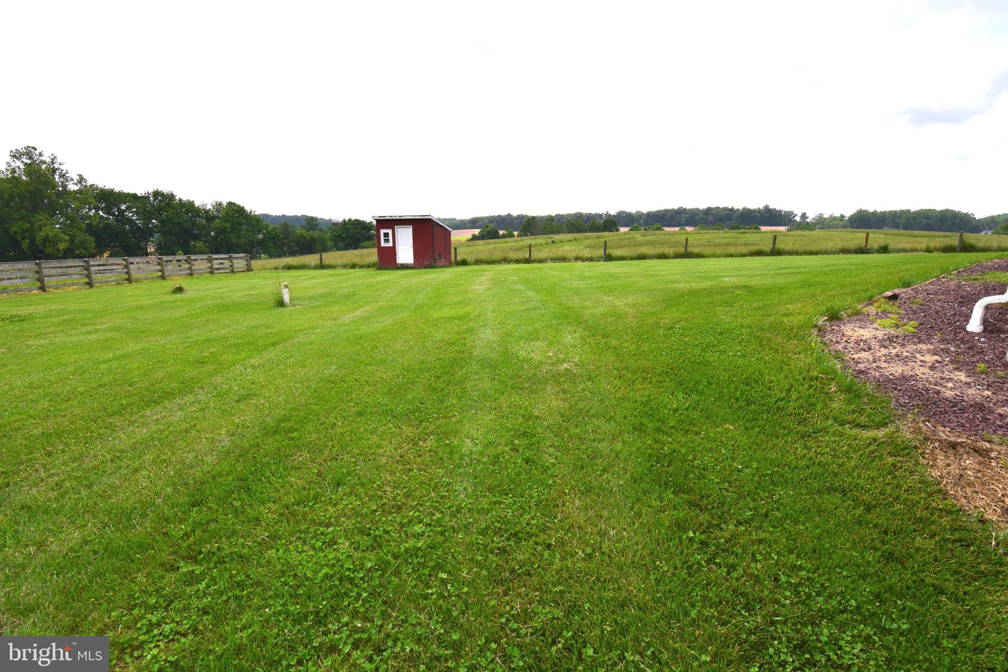 3875 Bark Hill Road Union Bridge, MD 21791 - Photo 121 of 142 a view of a green field with wooden fence