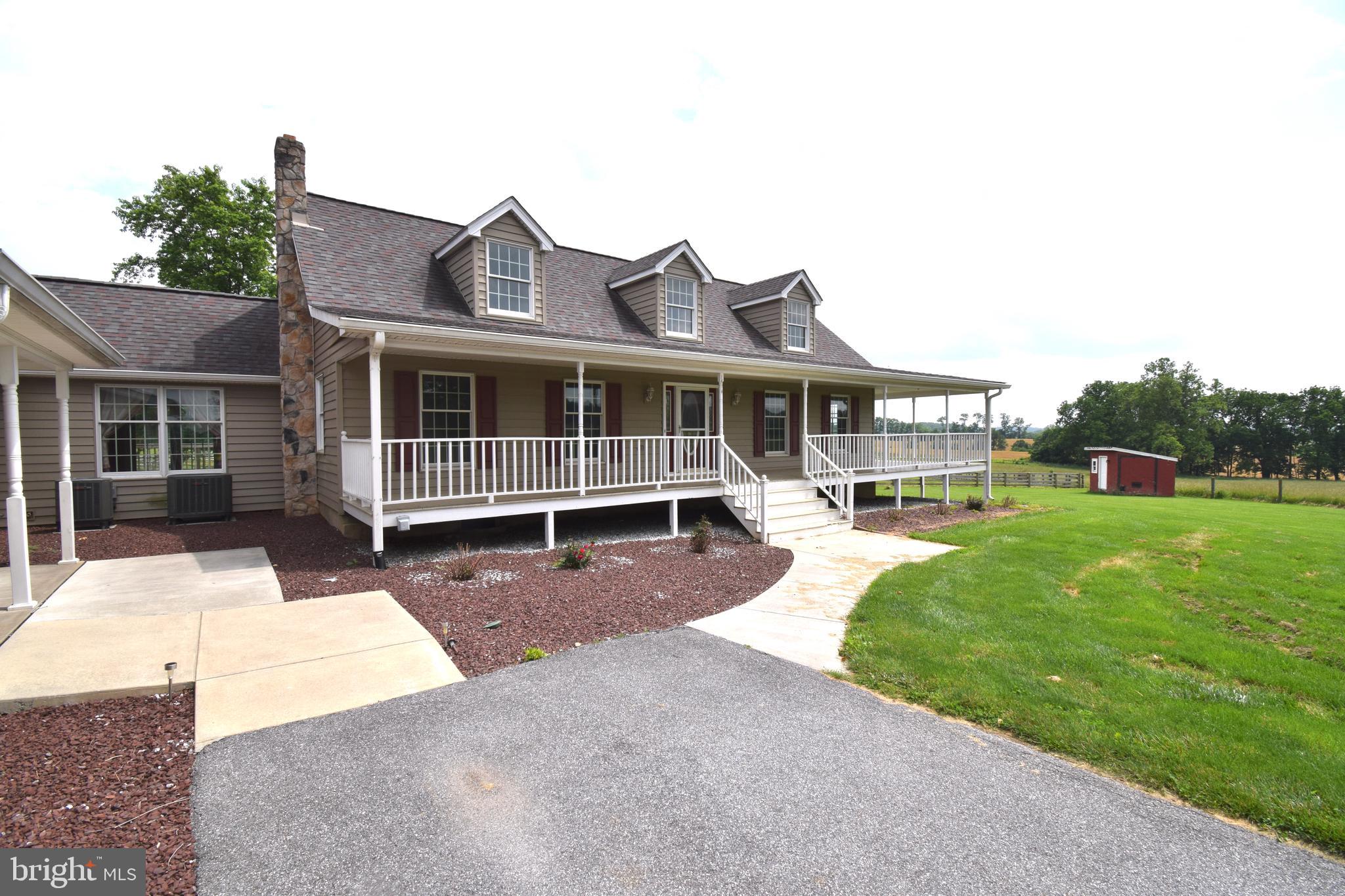 3875 Bark Hill Road Union Bridge, MD 21791 - Photo 140 of 142 a view of a house with a backyard and a patio
