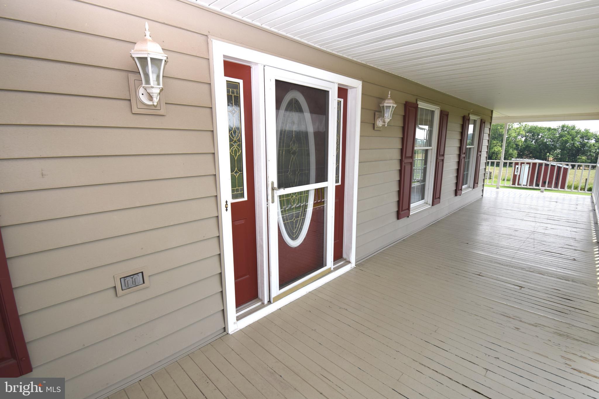3875 Bark Hill Road Union Bridge, MD 21791 - Photo 142 of 142 a view of a porch with wooden floor and fence