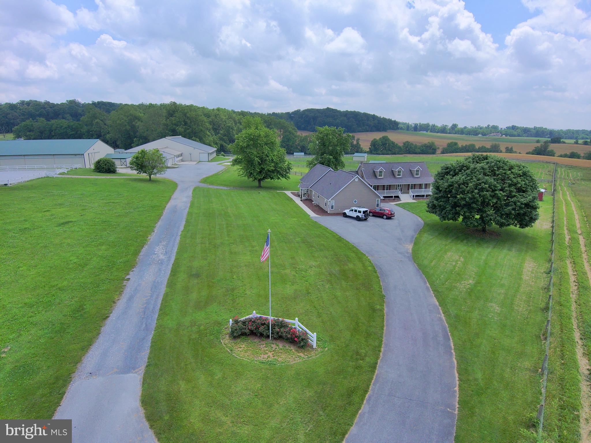 3875 Bark Hill Road Union Bridge, MD 21791 - Photo 16 of 142 an aerial view of a golf course with a garden