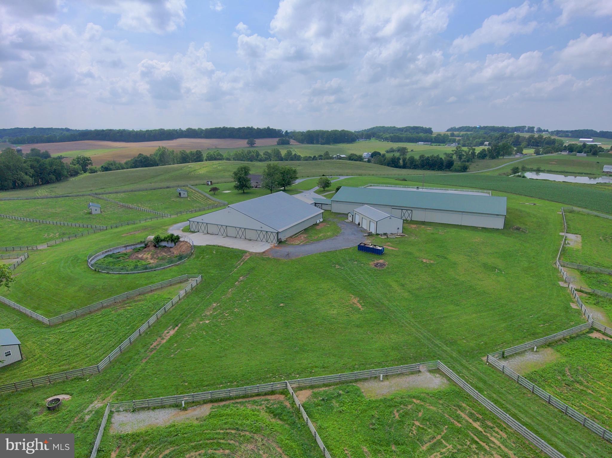 3875 Bark Hill Road Union Bridge, MD 21791 - Photo 27 of 142 an aerial view of a golf course with a lake view