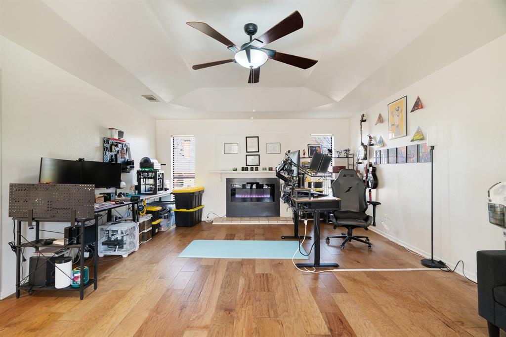 420 39th Street Southeast Paris, TX 75462 - Photo 11 of 25 a living room with lots of furniture and a wooden floor