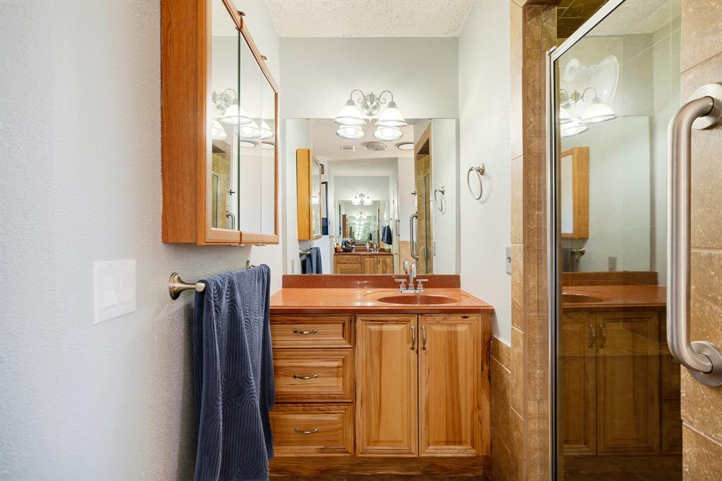 420 39th Street Southeast Paris, TX 75462 - Photo 15 of 25 a bathroom with a sink and a mirror