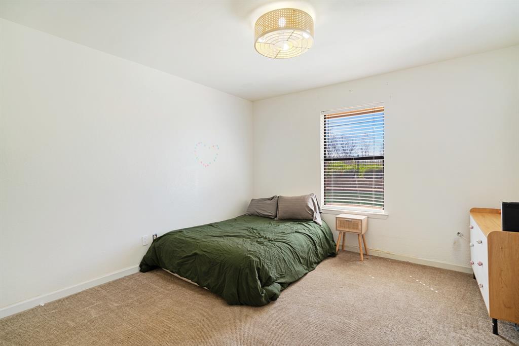 420 39th Street Southeast Paris, TX 75462 - Photo 17 of 25 a bedroom with a bed window and a window