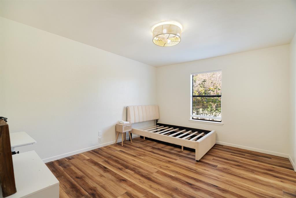 420 39th Street Southeast Paris, TX 75462 - Photo 18 of 25 a bedroom with a bed and a window