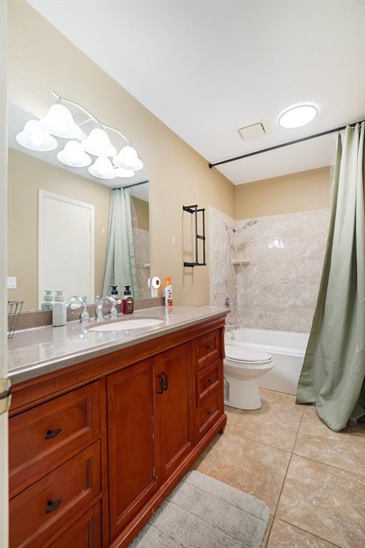 420 39th Street Southeast Paris, TX 75462 - Photo 21 of 25 a bathroom with a granite countertop sink mirror bathtub and toilet