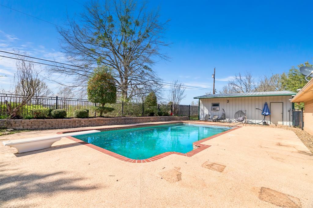 420 39th Street Southeast Paris, TX 75462 - Photo 23 of 25 a view of a swimming pool with a patio