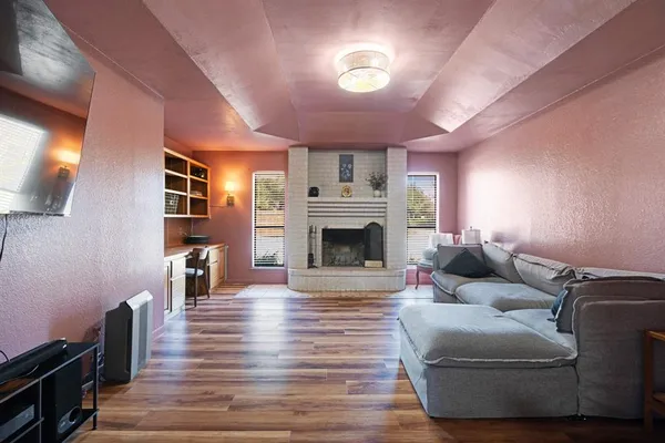 a living room with furniture and a fireplace
