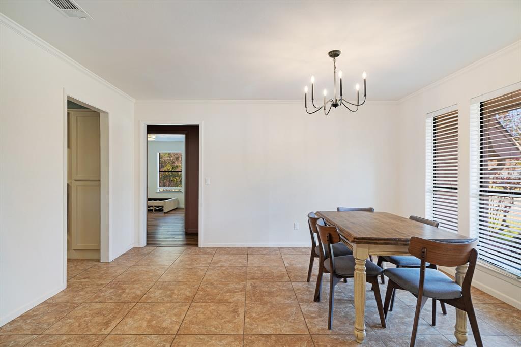 420 39th Street Southeast Paris, TX 75462 - Photo 5 of 25 a view of a dining room with furniture and chandelier
