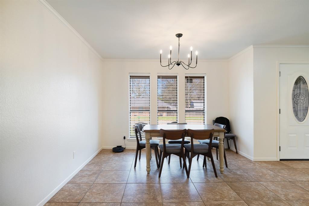420 39th Street Southeast Paris, TX 75462 - Photo 6 of 25 a view of a dining room with furniture and window