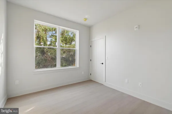 a bathroom with a toilet a sink a mirror and bathtub