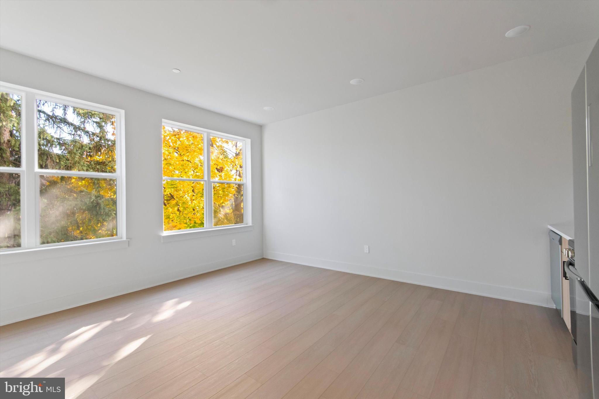 5521 Wayne Avenue, Unit 207 Philadelphia, PA 19144 - Photo 14 of 16 an empty room with windows