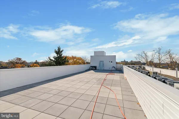 a kitchen with stainless steel appliances granite countertop a refrigerator stove and a sink