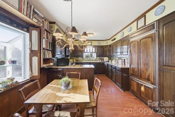 a living room with furniture ceiling fan and a rug