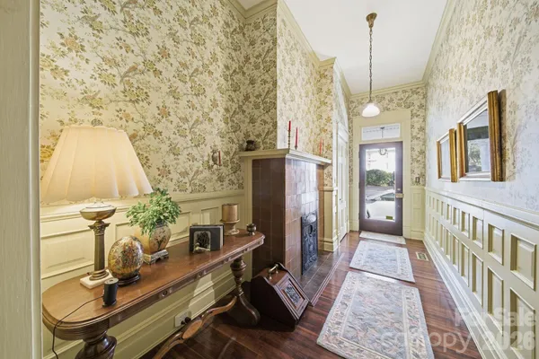 a view of entryway with furniture and wooden floor