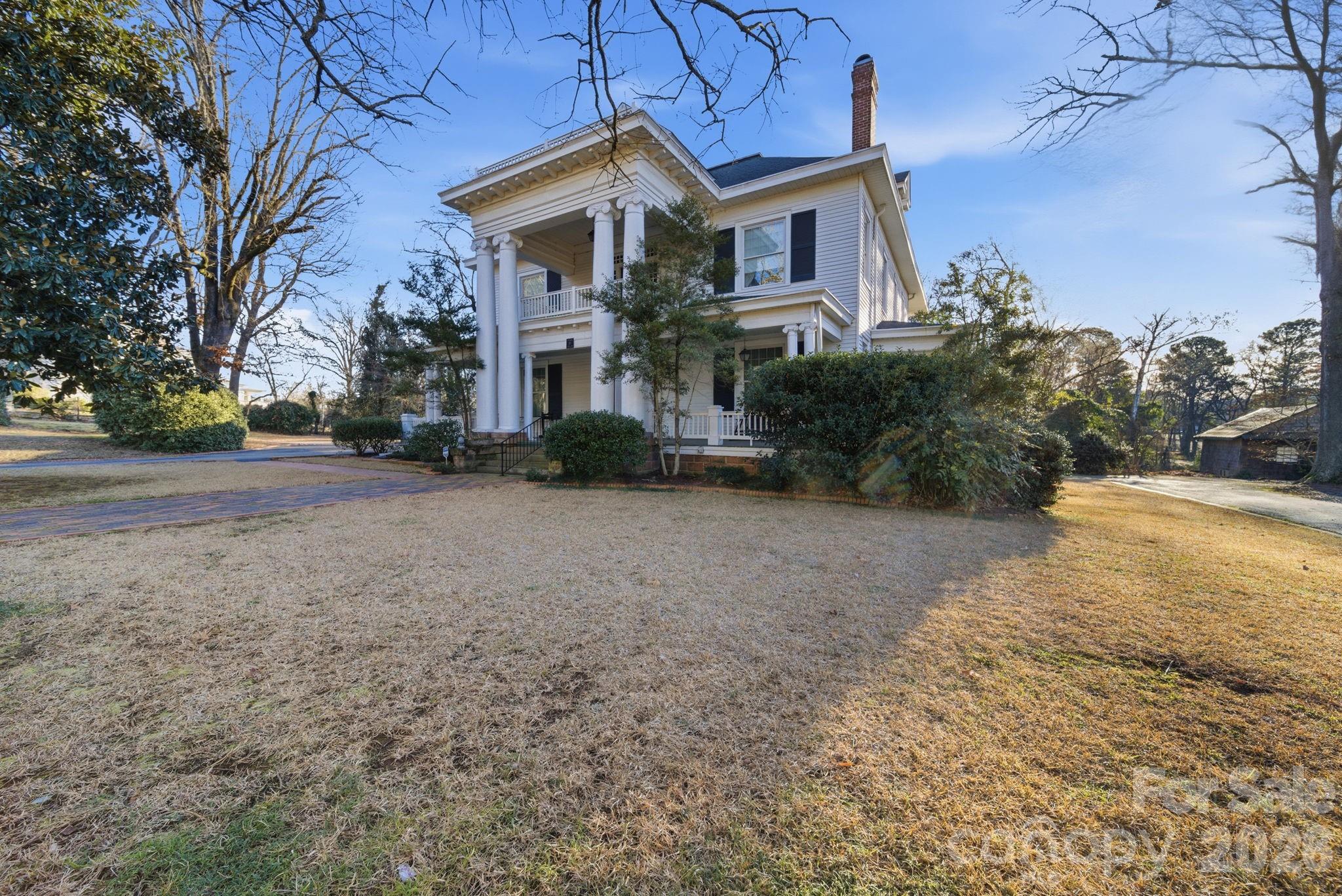 515 Camden Road Wadesboro, NC 28170 - Photo 2 of 36 a view of a house with a yard and garage