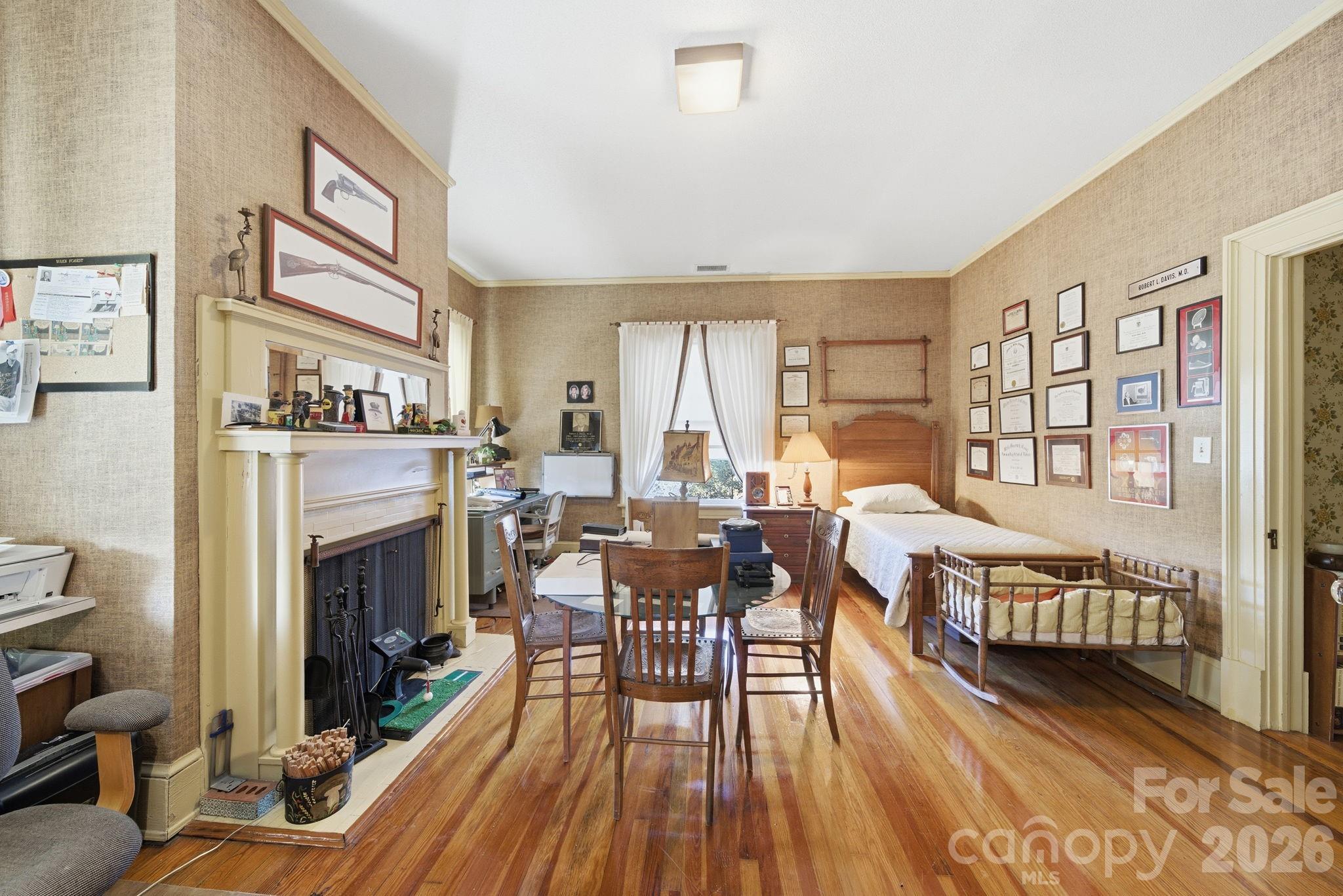 515 Camden Road Wadesboro, NC 28170 - Photo 25 of 36 a living room with furniture fireplace and wooden floor