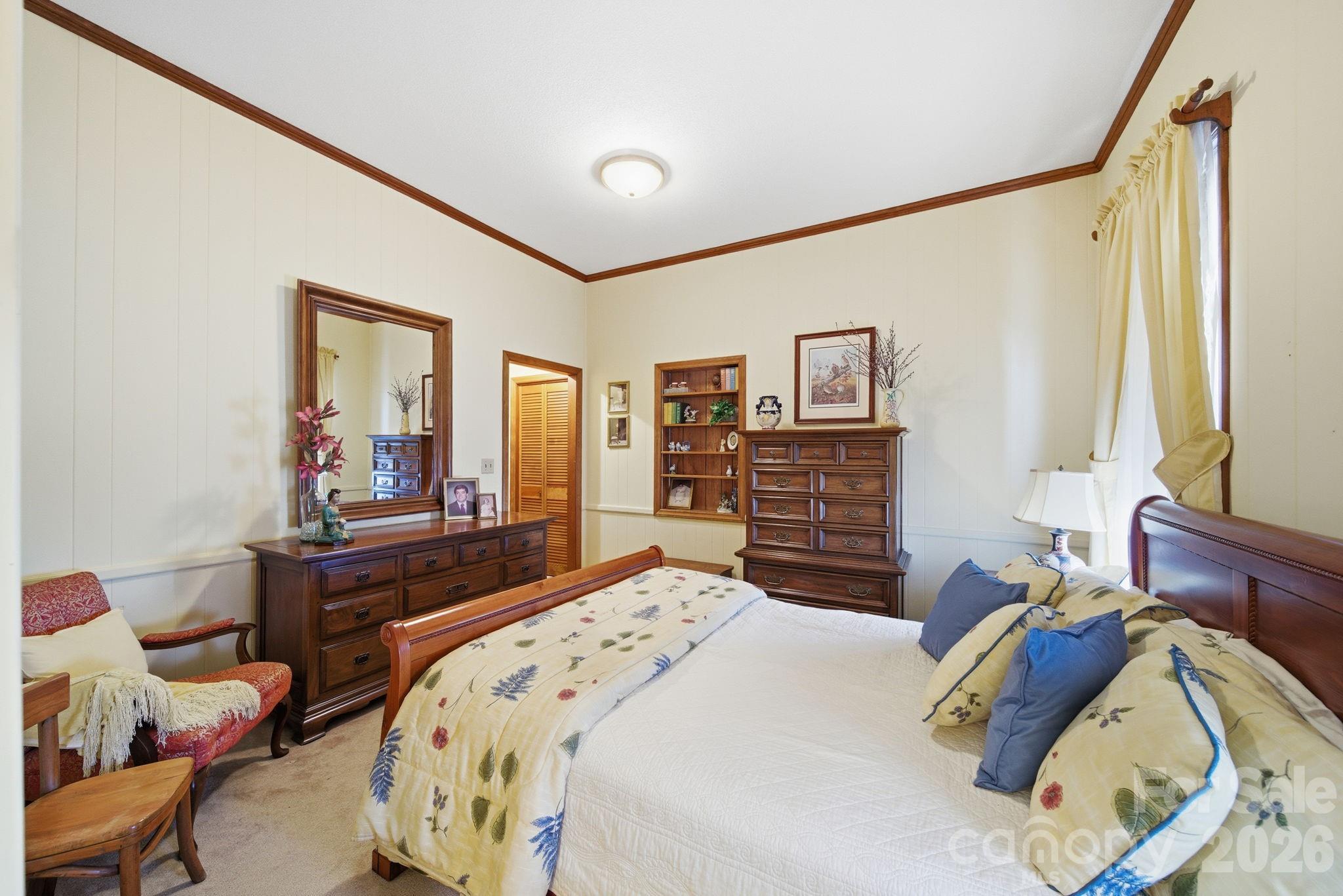 515 Camden Road Wadesboro, NC 28170 - Photo 26 of 36 a bedroom with a bed and a dresser