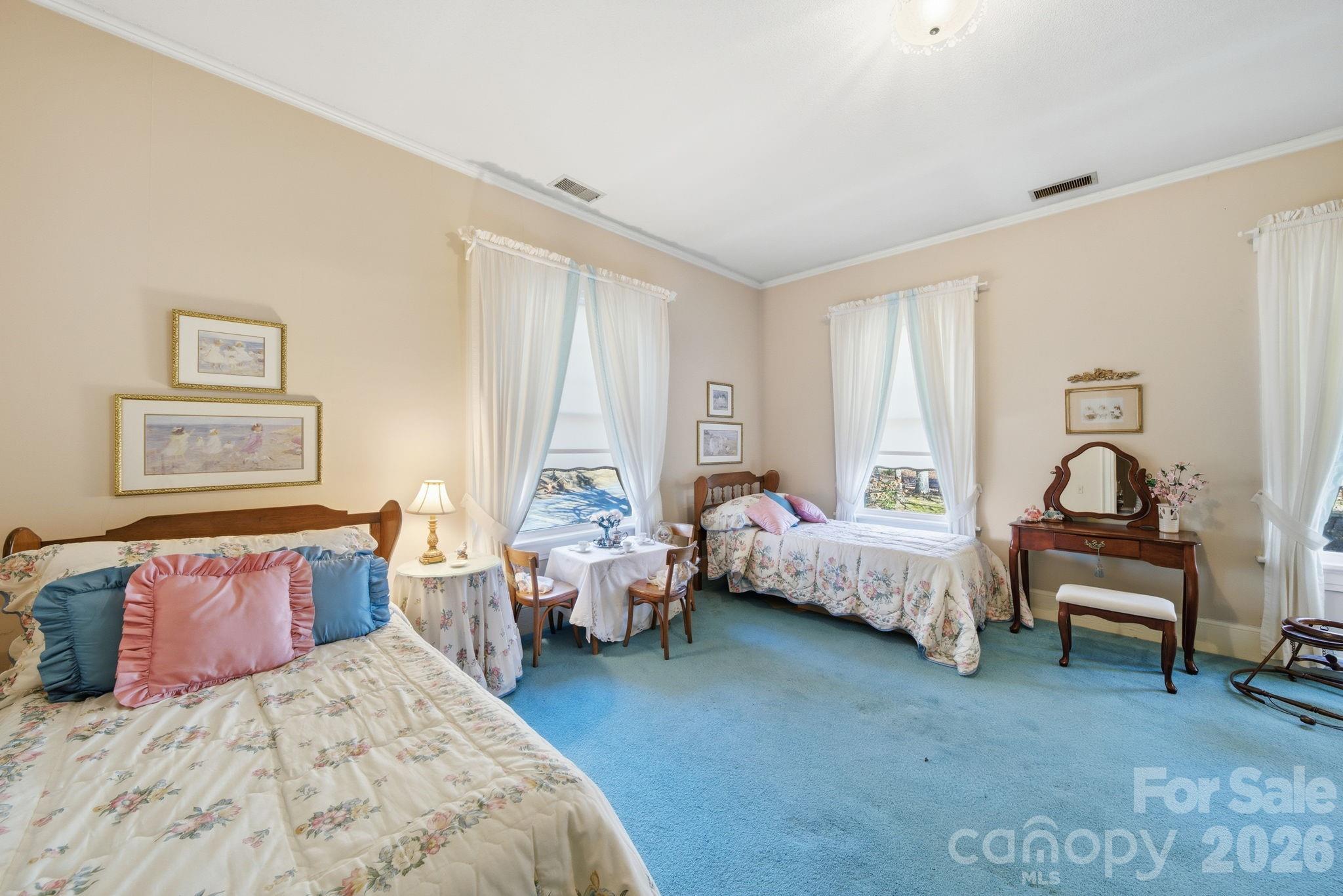 515 Camden Road Wadesboro, NC 28170 - Photo 28 of 36 a bedroom with bed and a lounge chair