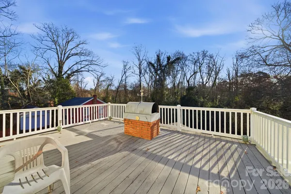 a view of a porch with furniture and a gate