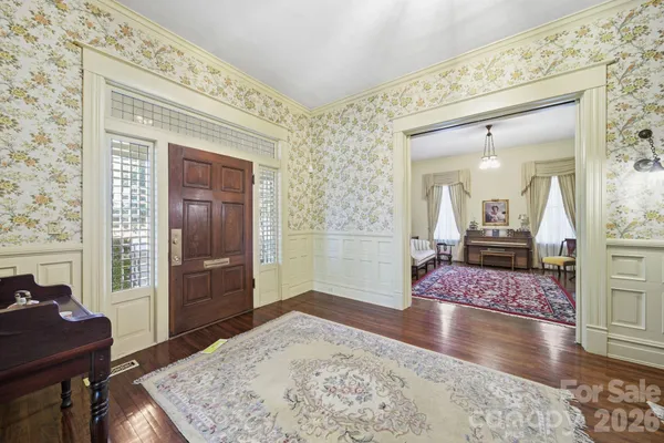 a view of a livingroom with furniture and wooden floor