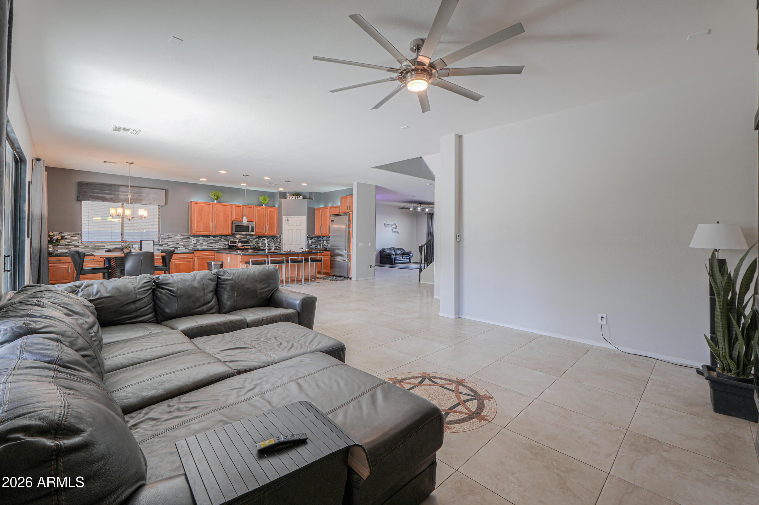 45247 West Jack Rabbit Trail Maricopa, AZ 85139 - Photo 24 of 75 a living room with furniture and a chandelier