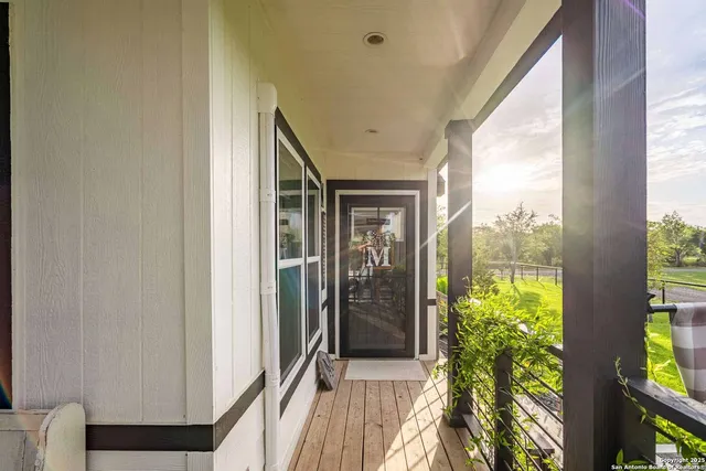 a view of balcony and wooden floor
