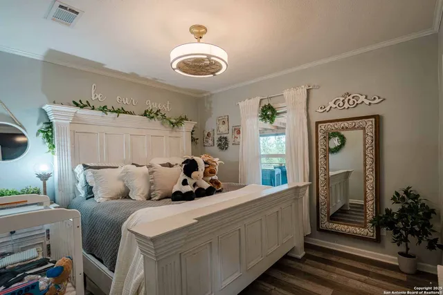 a bed room with a bed and a chandelier