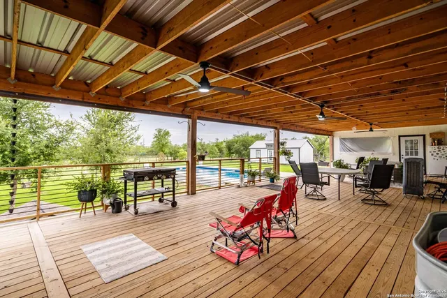a house view with swimming pool and sitting space