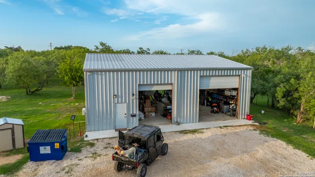 a view of a garage with a table and chairs