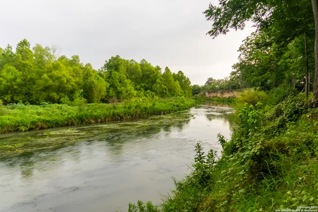 a view of a lake view with houses in back