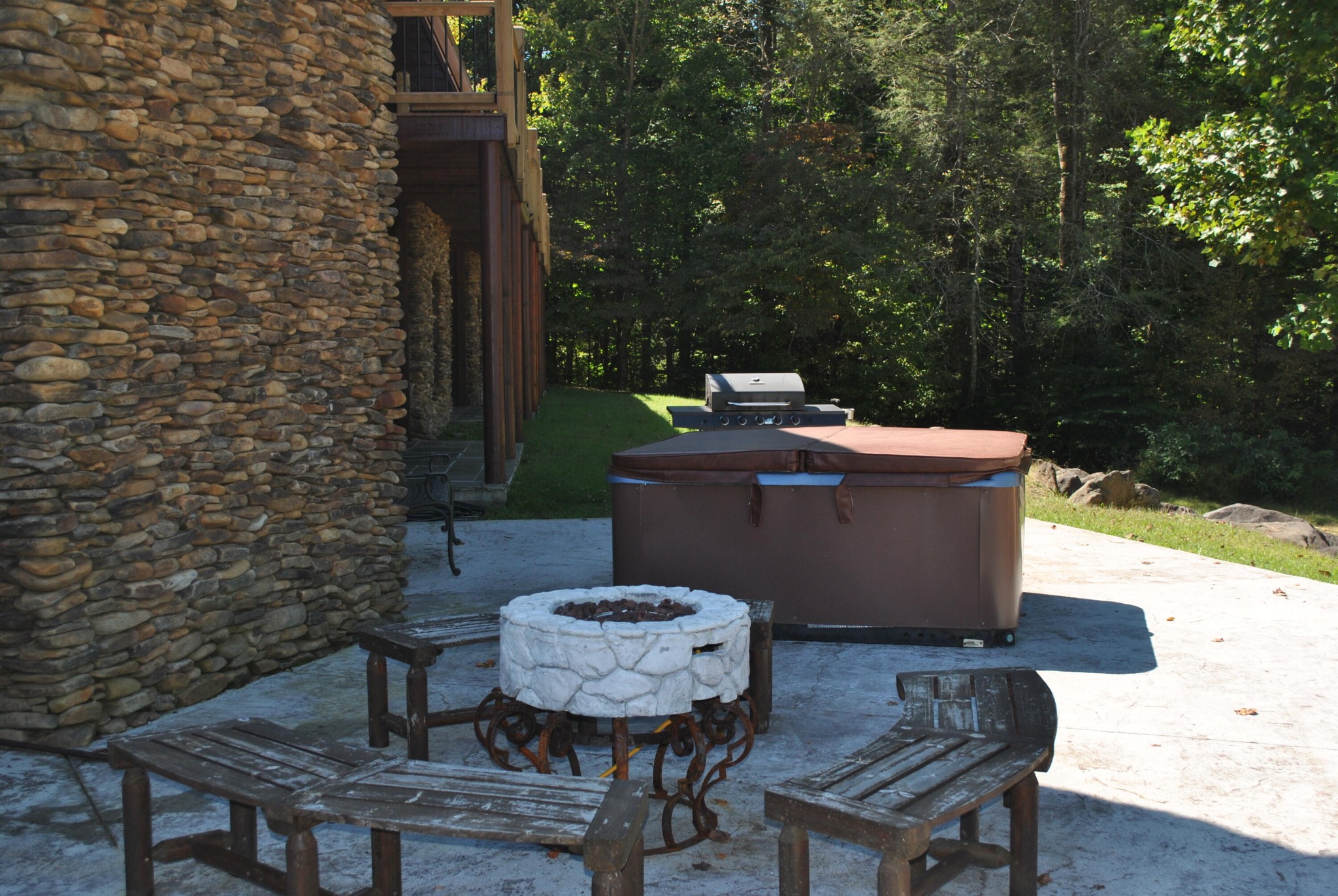206 Forrest Loop Way, Unit 23 Gatlinburg, TN 37738 - Photo 12 of 16 a view of a table and chairs in back yard of the house