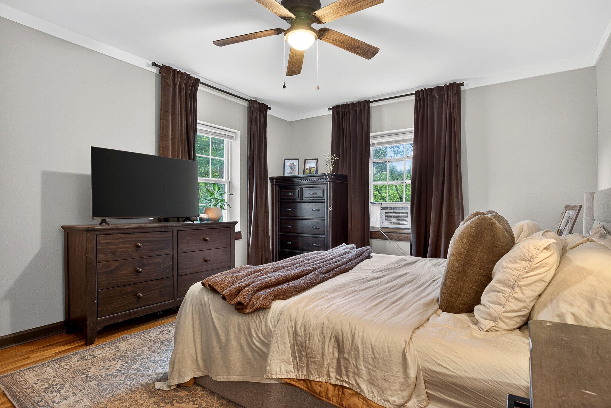 9388 Harrison Ferry Road McMinnville, TN 37110 - Photo 16 of 41 a bedroom with a bed and a flat screen tv