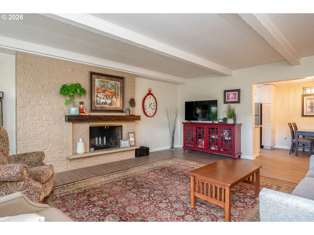 4460 Southwest Scholls Ferry Road, Unit 6A Portland, OR 97225 - Photo 12 of 25 a living room with furniture a flat screen tv and a fireplace
