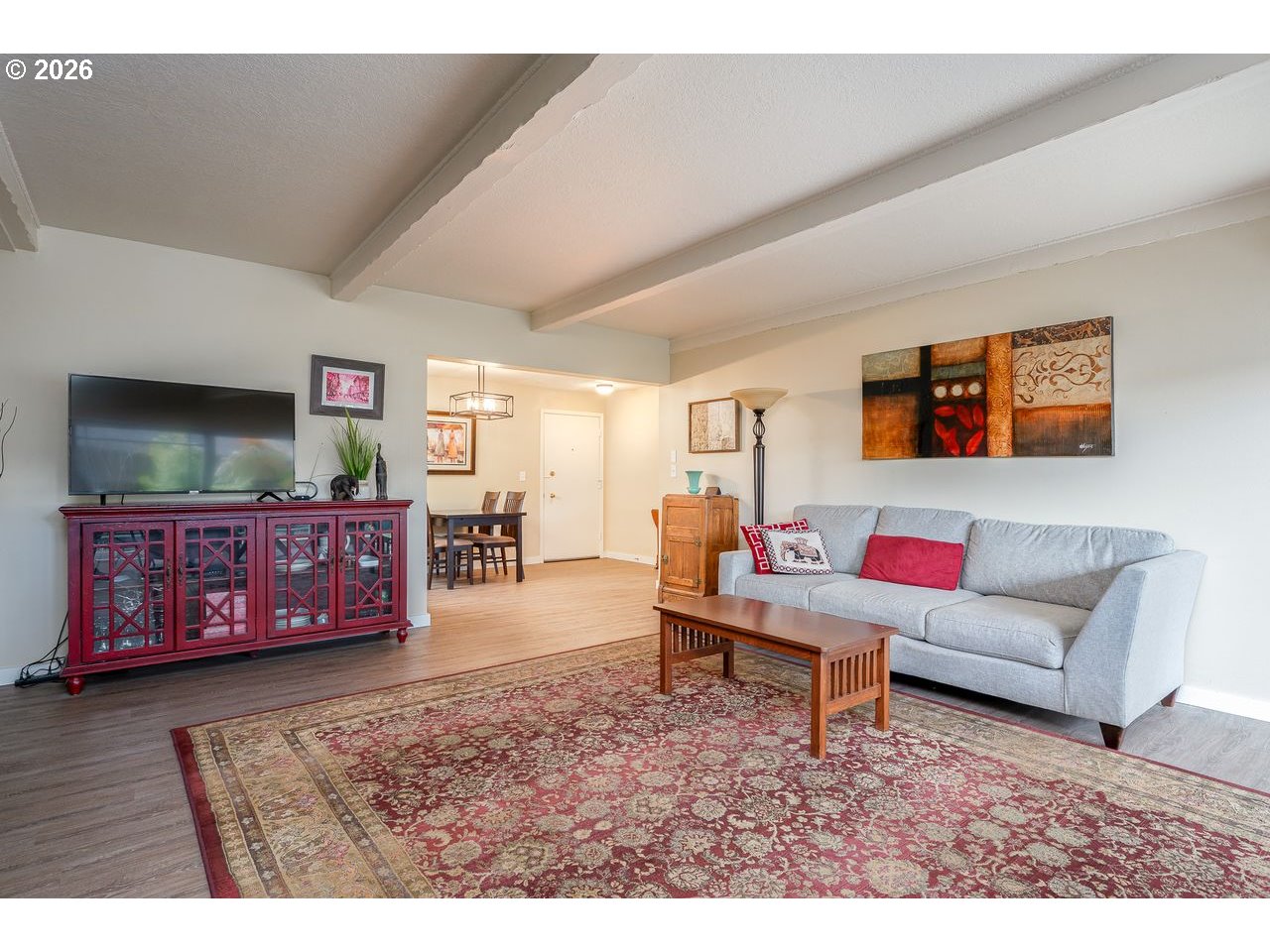 4460 Southwest Scholls Ferry Road, Unit 6A Portland, OR 97225 - Photo 13 of 25 a living room with furniture and a flat screen tv