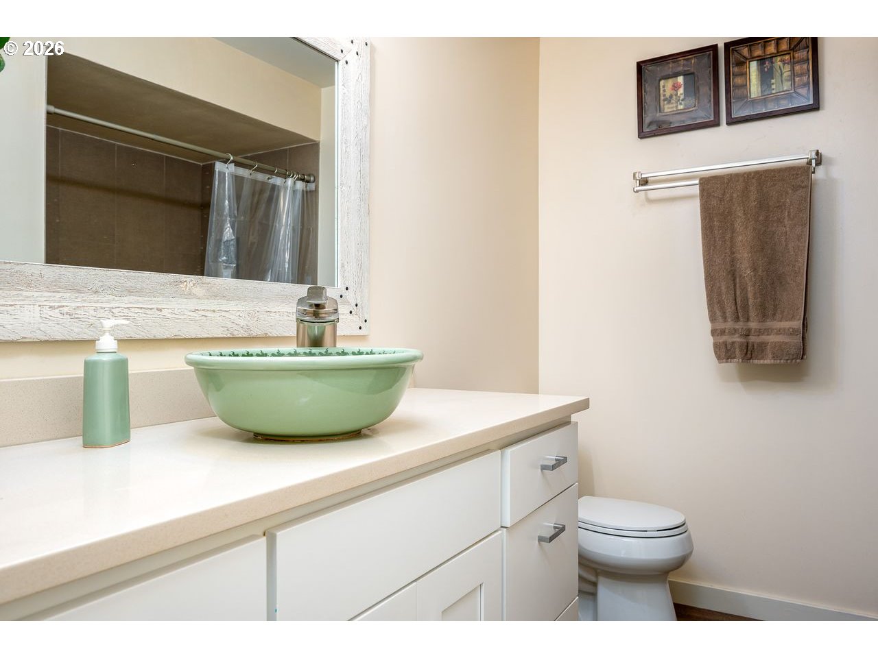 4460 Southwest Scholls Ferry Road, Unit 6A Portland, OR 97225 - Photo 16 of 25 a view of bathroom with a toilet sink and mirror