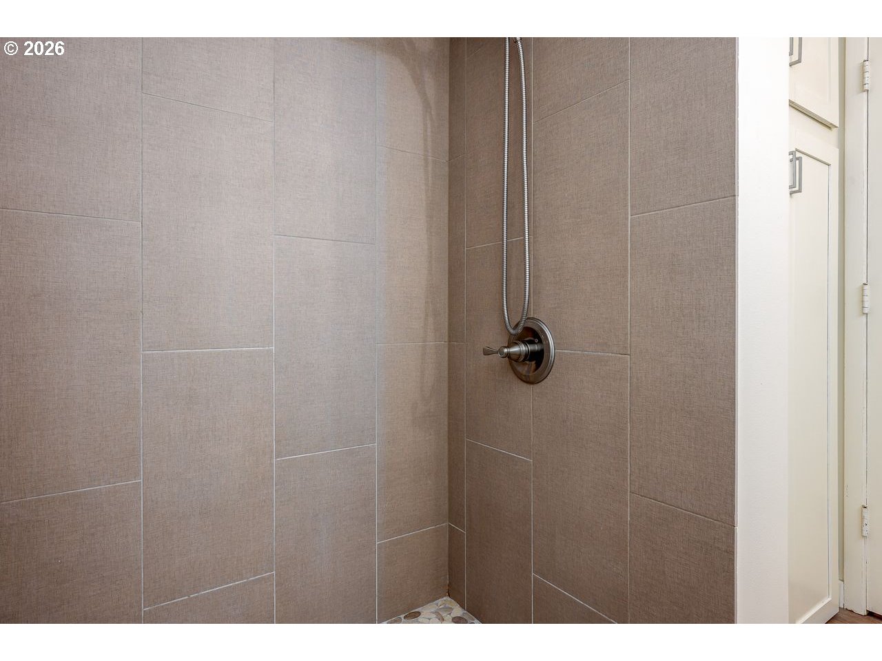 4460 Southwest Scholls Ferry Road, Unit 6A Portland, OR 97225 - Photo 17 of 25 a bathroom with a shower