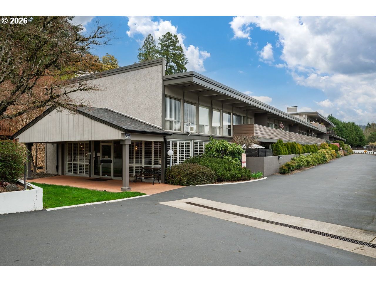 4460 Southwest Scholls Ferry Road, Unit 6A Portland, OR 97225 - Photo 2 of 25 a front view of a house with a yard