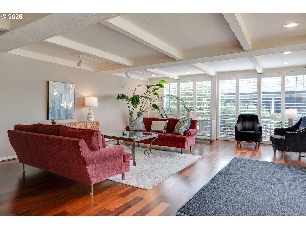 4460 Southwest Scholls Ferry Road, Unit 6A Portland, OR 97225 - Photo 24 of 25 a living room with furniture floor to ceiling window and a table