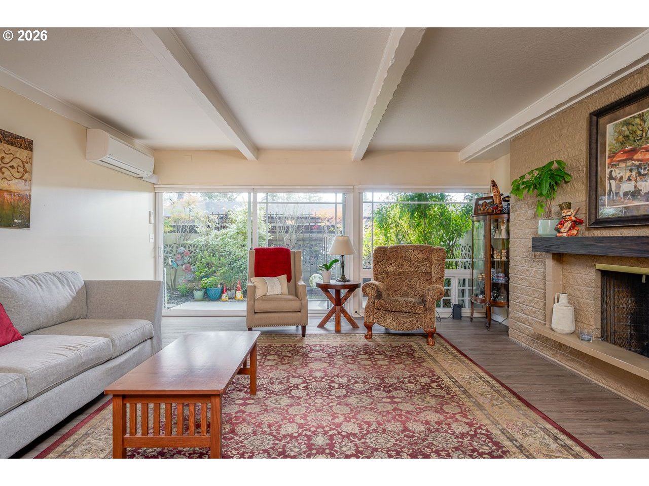 4460 Southwest Scholls Ferry Road, Unit 6A Portland, OR 97225 - Photo 5 of 25 a living room with furniture and a fireplace