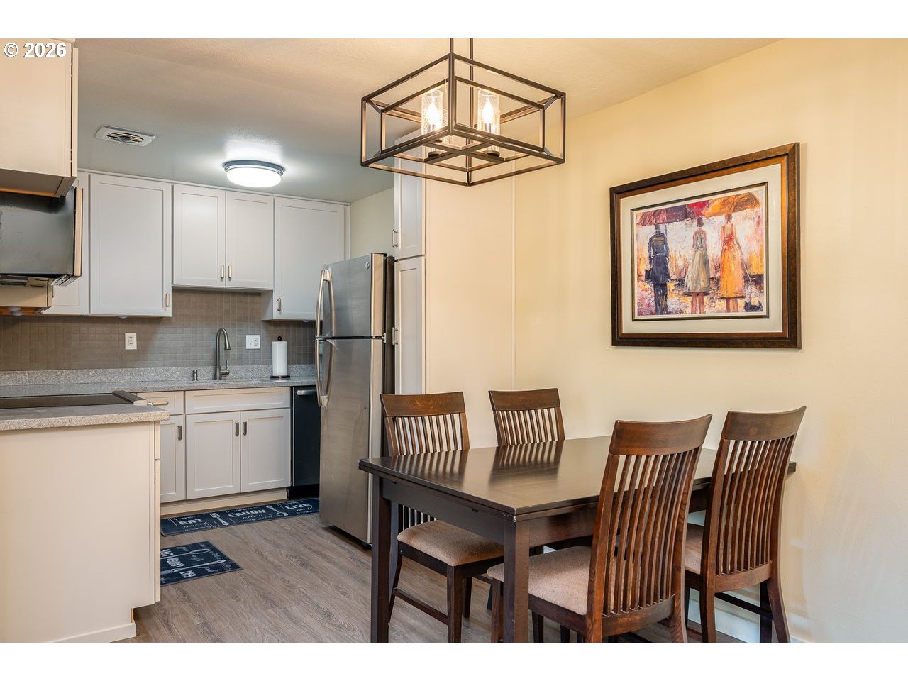 4460 Southwest Scholls Ferry Road, Unit 6A Portland, OR 97225 - Photo 9 of 25 a view of kitchen and dining area with chandelier