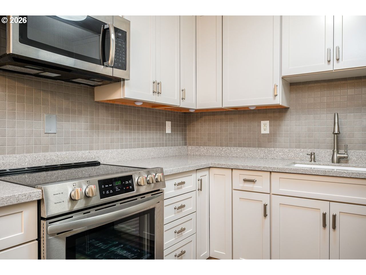 4460 Southwest Scholls Ferry Road, Unit 6A Portland, OR 97225 - Photo 10 of 25 a kitchen with appliances a sink and cabinets