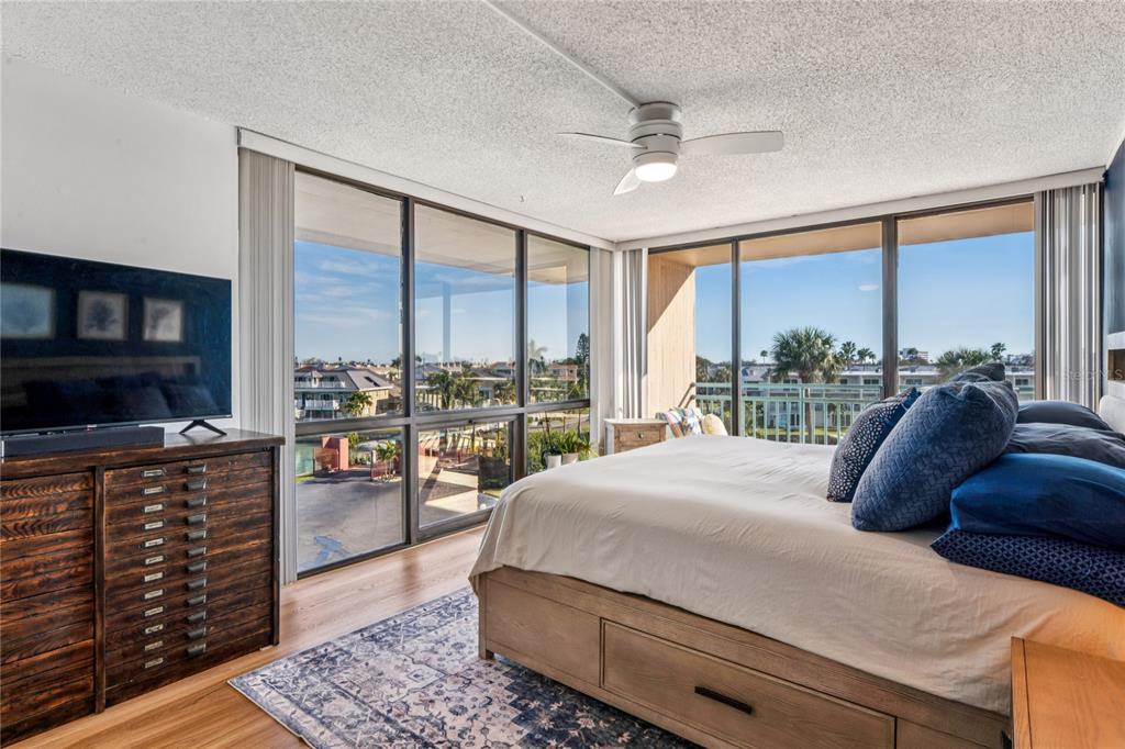 1 Key Capri, Unit 312E Treasure Island, FL 33706 - Photo 3 of 86 a bedroom with a large bed and a large window