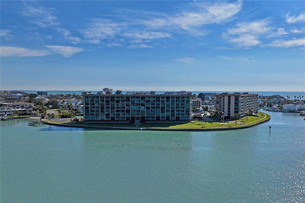 1 Key Capri, Unit 312E Treasure Island, FL 33706 - Photo 42 of 86 a view of a swimming pool with an ocean view