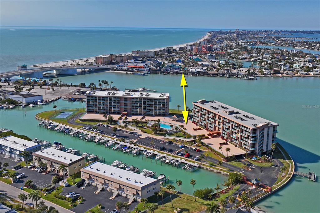 1 Key Capri, Unit 312E Treasure Island, FL 33706 - Photo 45 of 86 a view of a city with an ocean view