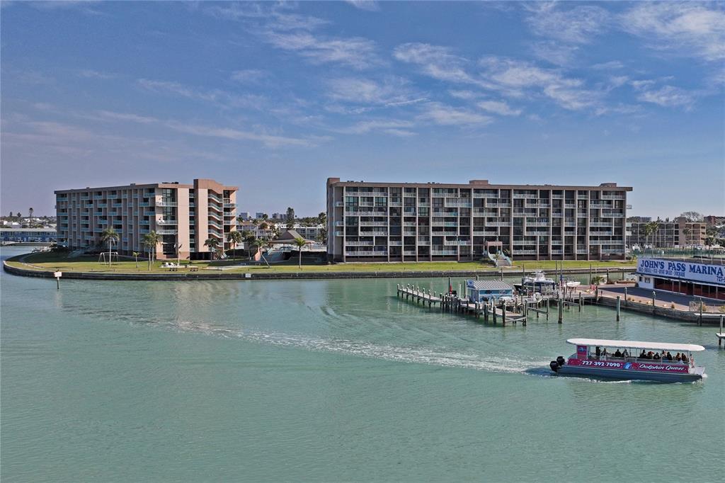 1 Key Capri, Unit 312E Treasure Island, FL 33706 - Photo 48 of 86 a view of a lake with a nearby beach