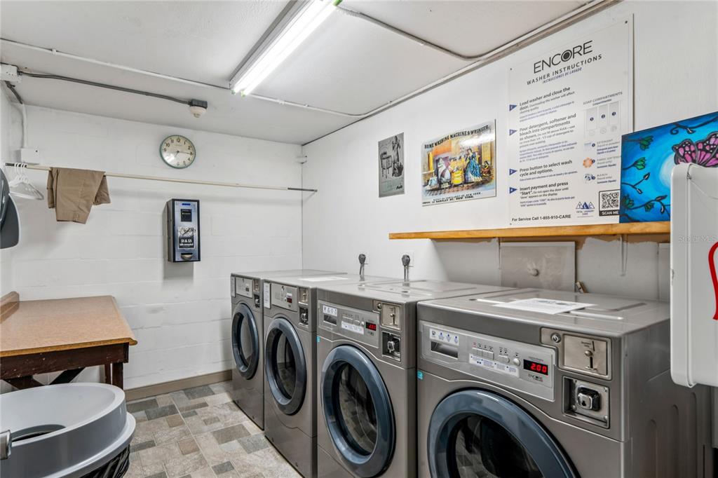 1 Key Capri, Unit 312E Treasure Island, FL 33706 - Photo 53 of 86 a utility room with dryer and washer
