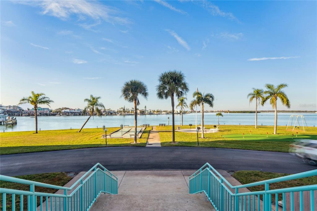 1 Key Capri, Unit 312E Treasure Island, FL 33706 - Photo 61 of 86 a view of swimming pool with outdoor seating and yard